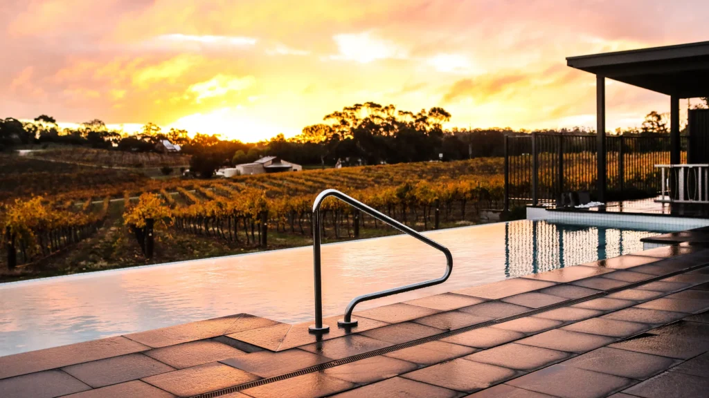 Sunset views over the vineyards and infinity pool at The Louise