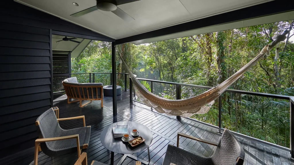 Deck of a Billabong Suite with hammock and outdoor seating with fire pit