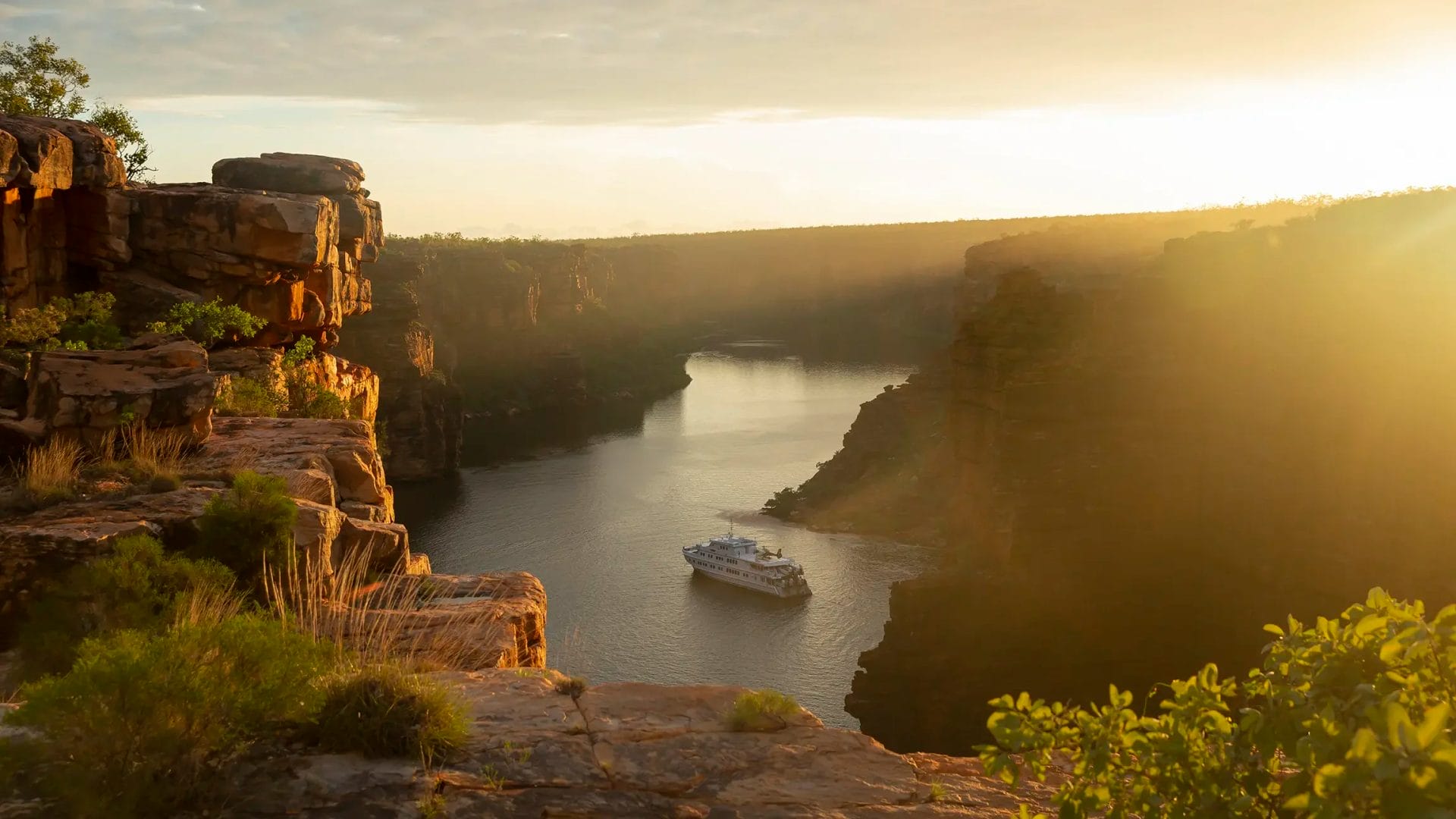 True North vessel within two steep gorges in the Kimberley, Western Australia, at golden hour