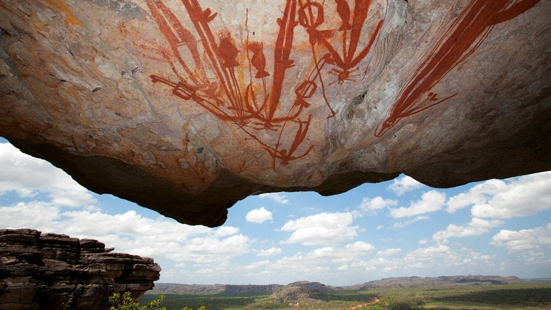 Ancient Aboriginal rock art on a cliff overhang in Arnhem Land.