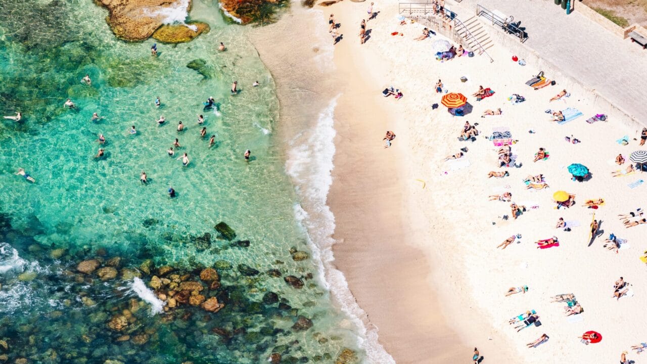 Aerial Perspective. People enjoying the beach at Bronte Beach, Sydney